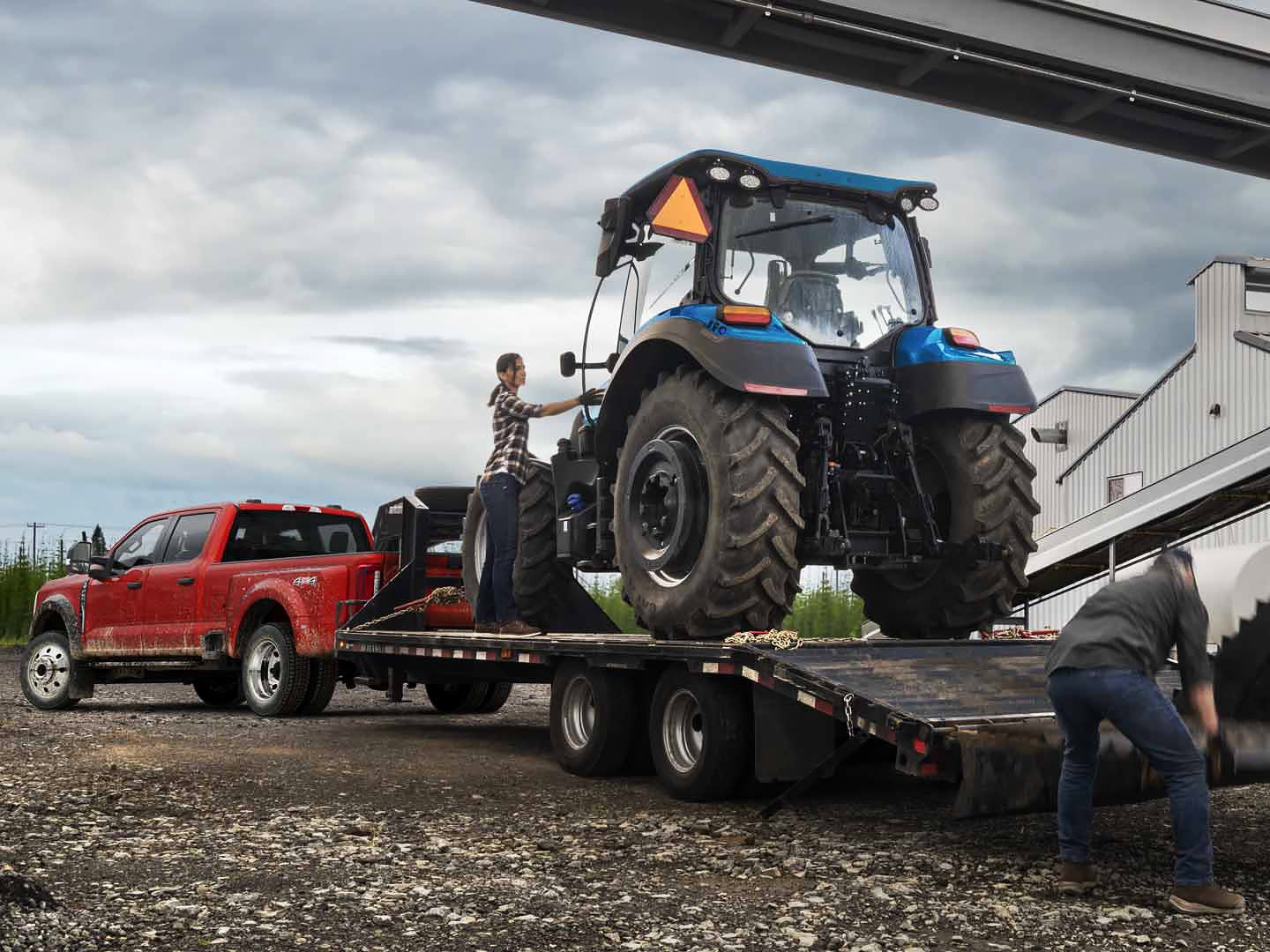 A diesel Super Duty® truck being prepared to tow a tractor