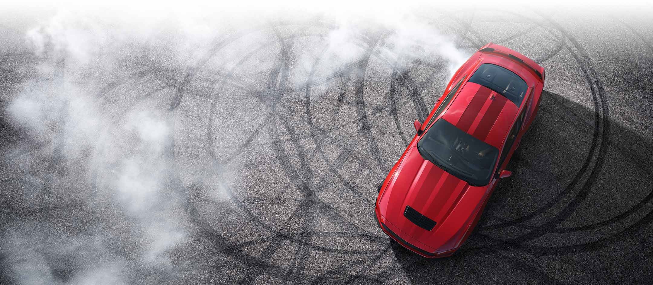 Overhead view of a 2024 Ford Mustang® model with tire tracks on pavement | Bear Lake Motor Company in Montpelier ID