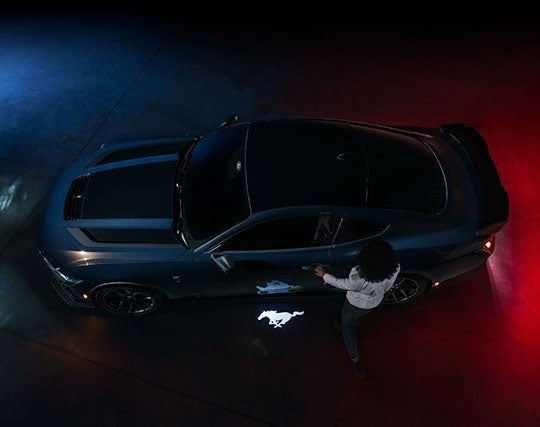 2024 Ford Mustang® Dark Horse™ model with a driver approaching the vehicle | Bear Lake Motor Company in Montpelier ID