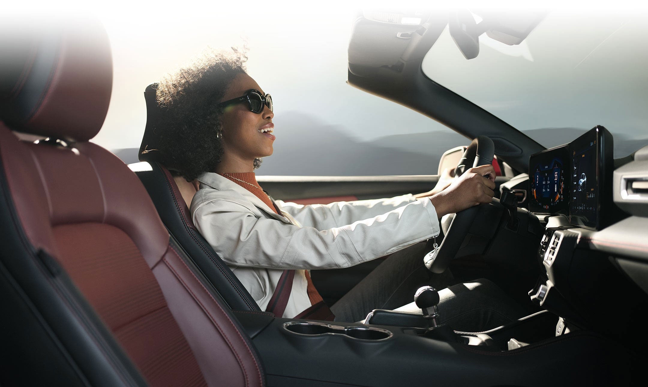 Person sitting in the driver’s seat of a 2024 Ford Mustang® convertible | Bear Lake Motor Company in Montpelier ID
