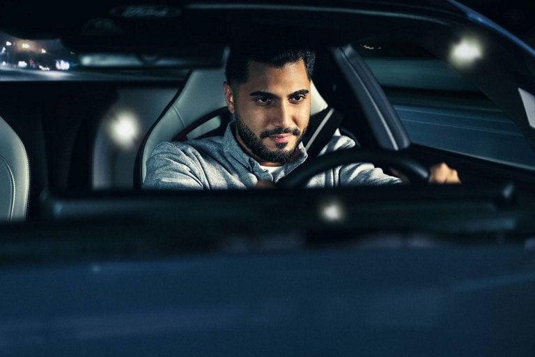 Person sitting in the driver’s seat of a parked 2024 Ford Mustang® coupe | Bear Lake Motor Company in Montpelier ID